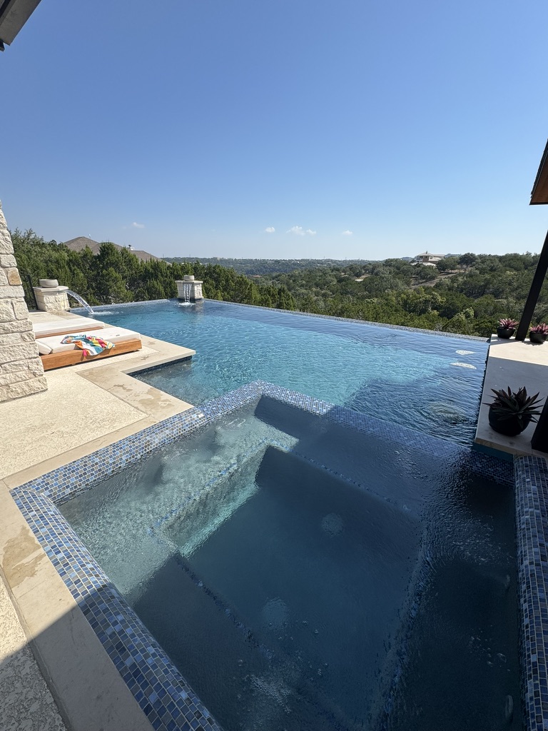 Pool technician brushing a pool in Austin, TX